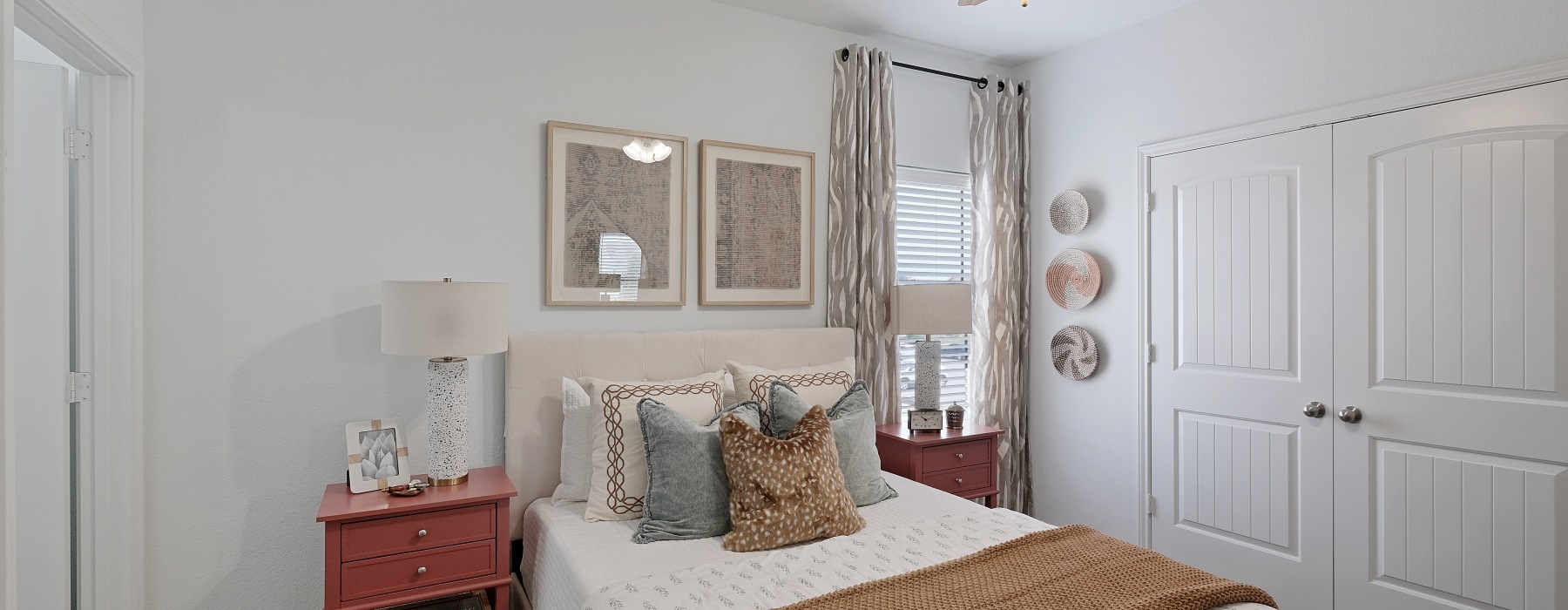 carpeted bedroom with a large window