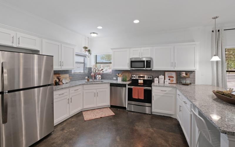 spacious kitchen with ample lighting throughout