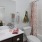 a bathroom with a pink shower curtain