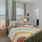 spacious bedroom with bright windows