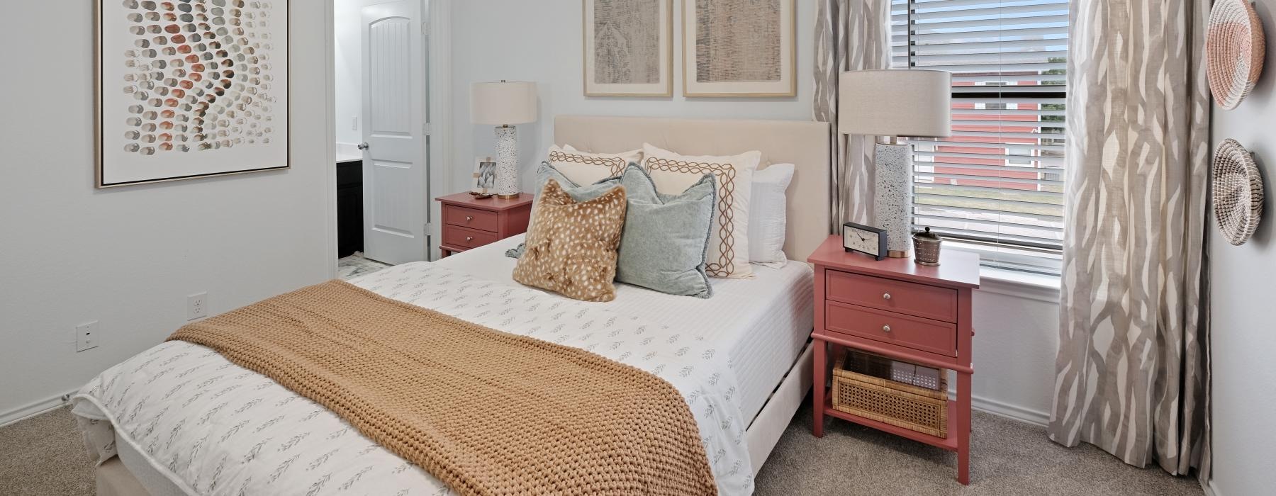 carpeted bedroom with a large window