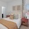 carpeted bedroom with a large window