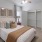 a bedroom with a ceiling fan and a bed